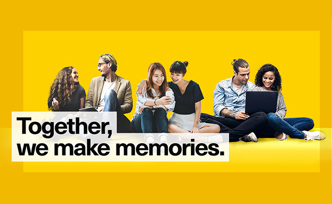 Kioxia header image people sat together